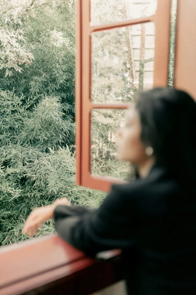 Woman looking out the window